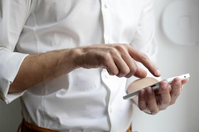 man touching phone
